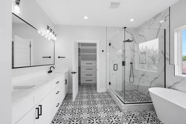 a white toilet sitting next to a bathtub