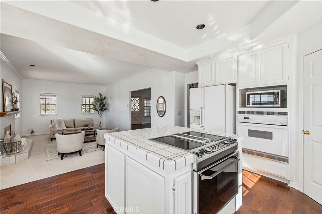 4131 Pelona Canyon Road Acton, CA 93510 - Photo 14 of 58 a kitchen with a stove and a refrigerator
