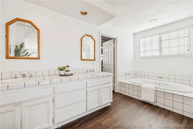a bathroom with a bathtub and a window