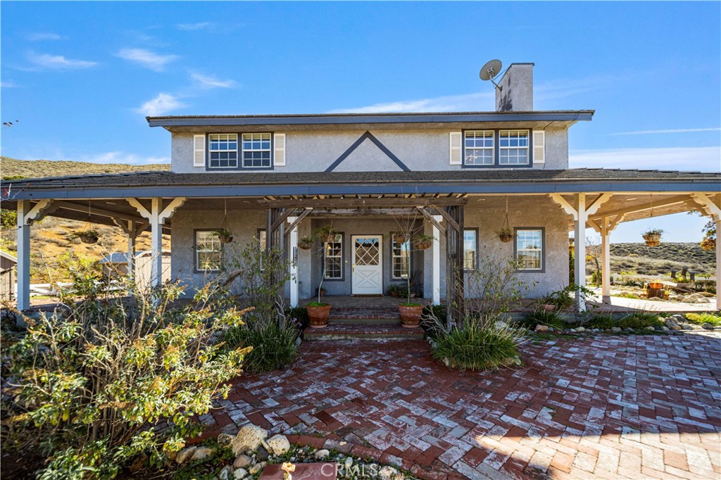 4131 Pelona Canyon Road Acton, CA 93510 - Photo 46 of 58 a front view of a house with garden