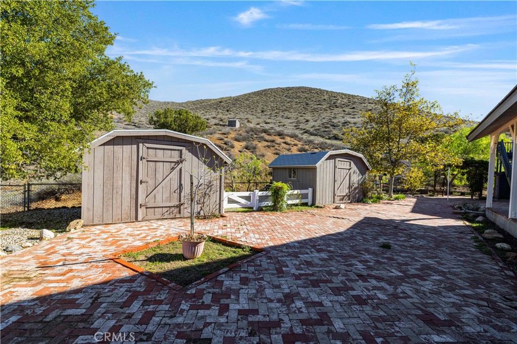 4131 Pelona Canyon Road Acton, CA 93510 - Photo 50 of 58 a view of a house with a yard