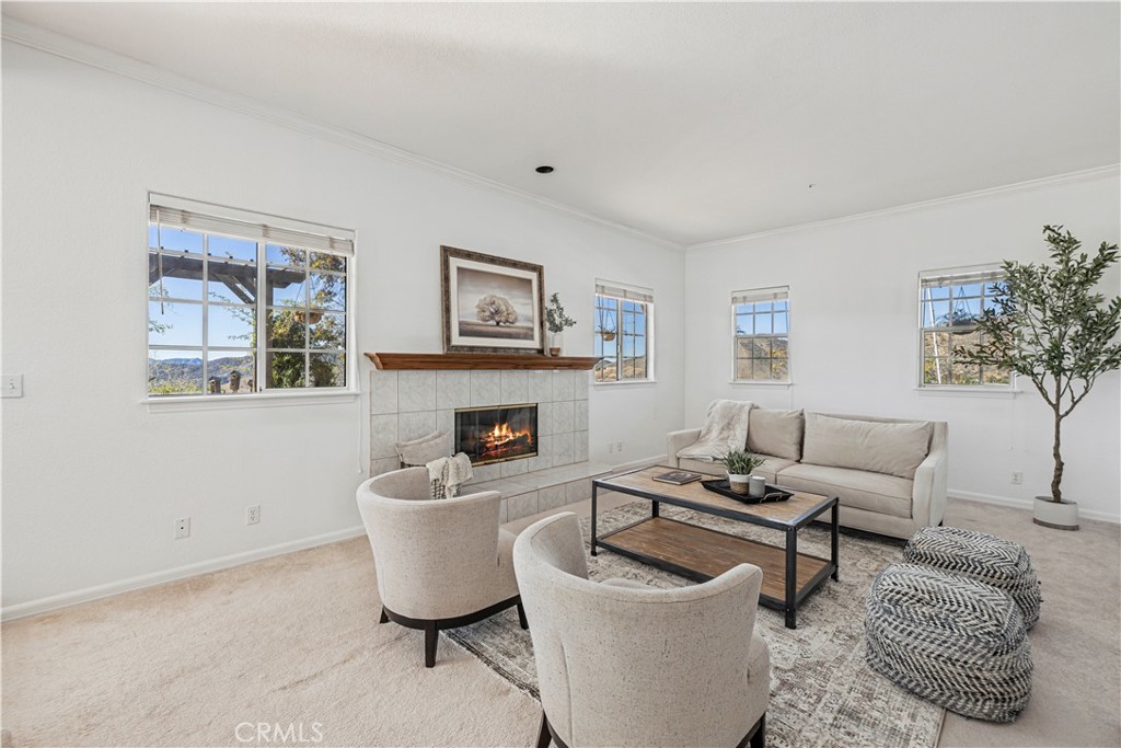 4131 Pelona Canyon Road Acton, CA 93510 - Photo 6 of 58 a living room with furniture and a fireplace