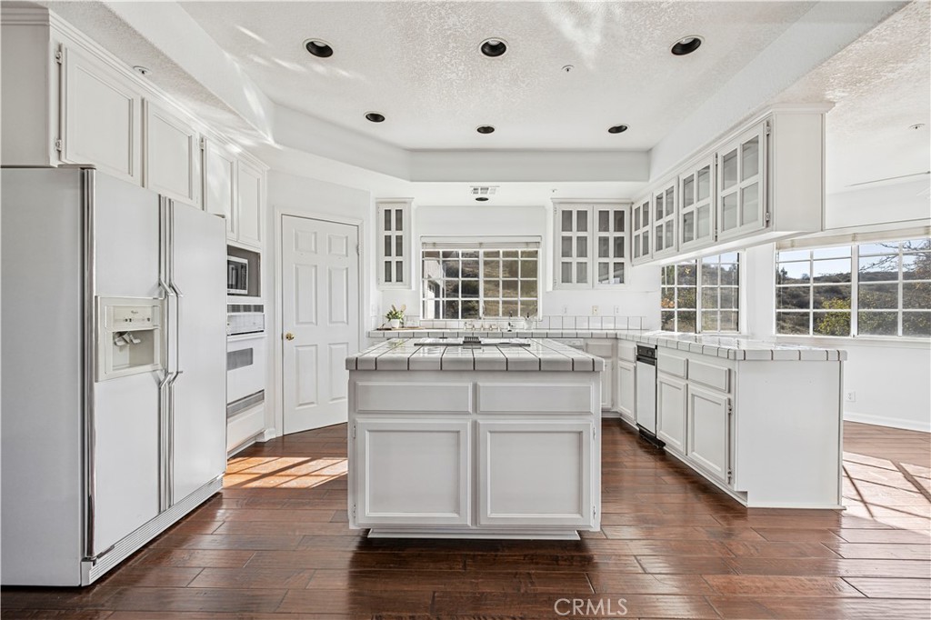 4131 Pelona Canyon Road Acton, CA 93510 - Photo 10 of 58 a kitchen with stainless steel appliances granite countertop a refrigerator and a stove