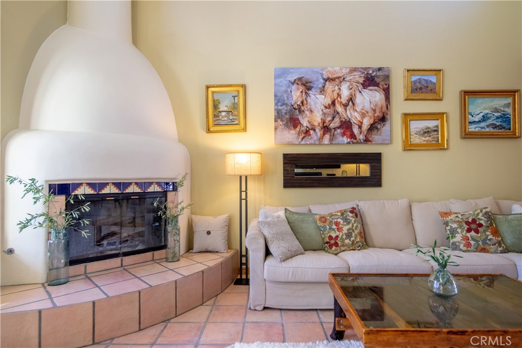 10900 Rimpau Road Fallbrook, CA 92028 - Photo 3 of 14 a living room with furniture and a fireplace