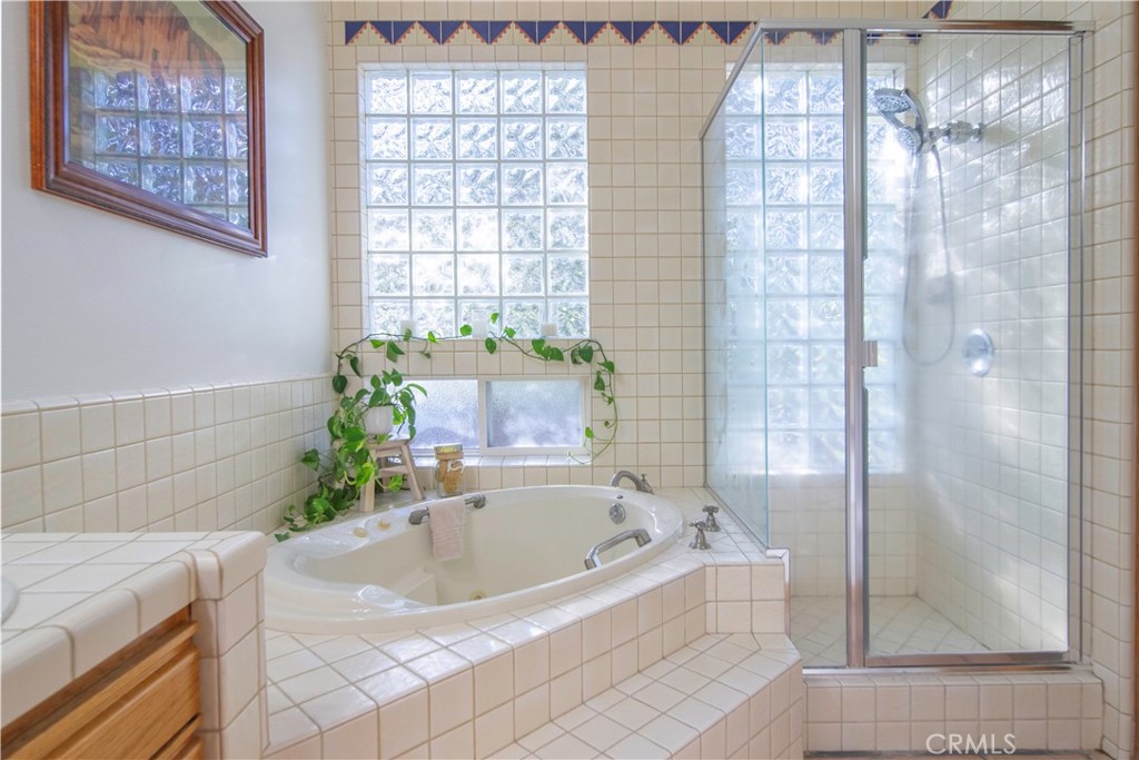 10900 Rimpau Road Fallbrook, CA 92028 - Photo 7 of 14 a bath tub sitting in a bathroom next to a tub