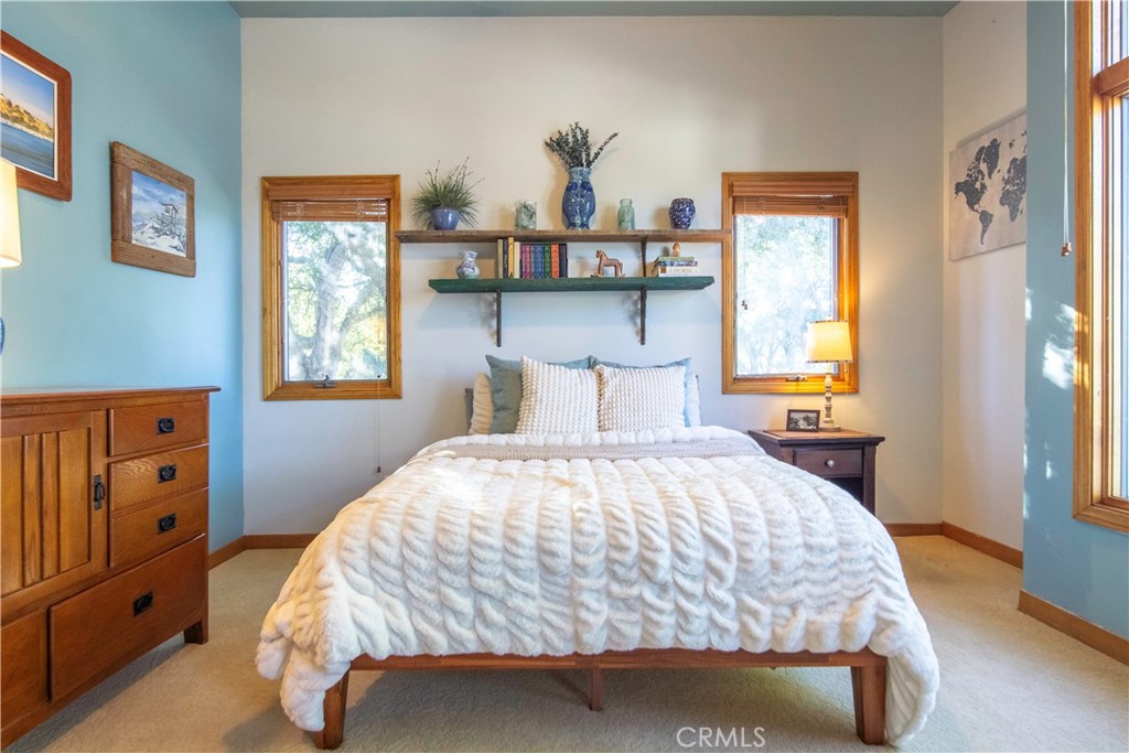 10900 Rimpau Road Fallbrook, CA 92028 - Photo 9 of 14 a bedroom with a bed and window