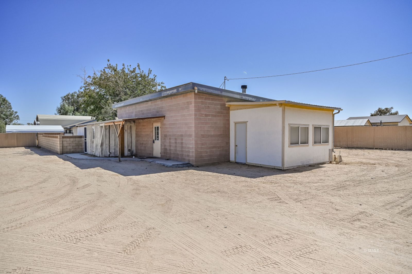 1572 North Calvert Boulevard Ridgecrest, CA 93555 - Photo 1 of 27 a backyard of a house