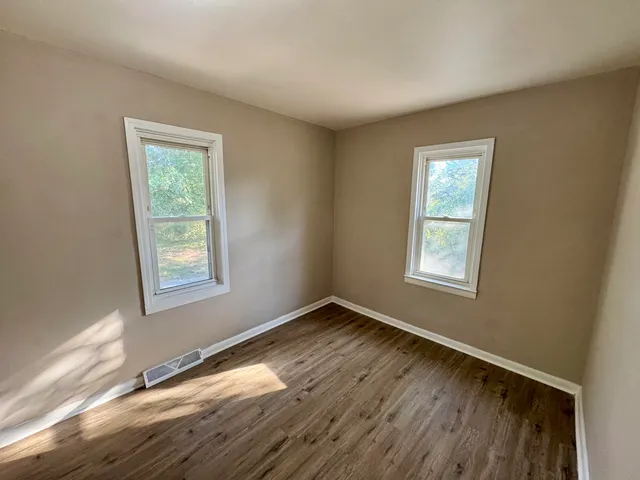 a view of an empty room and window