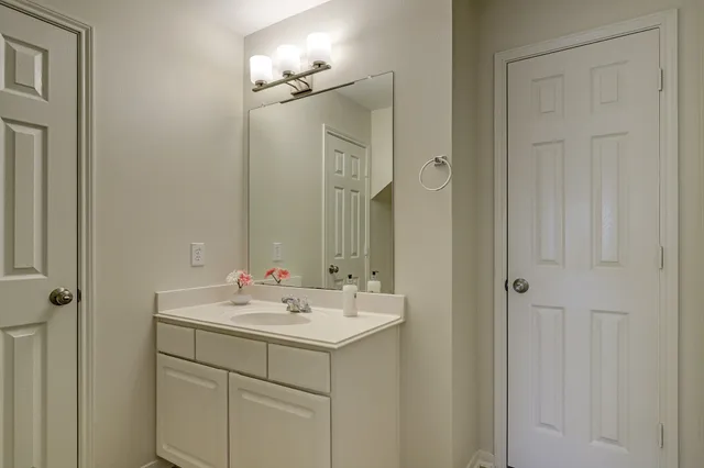 a bathroom with a sink and a mirror