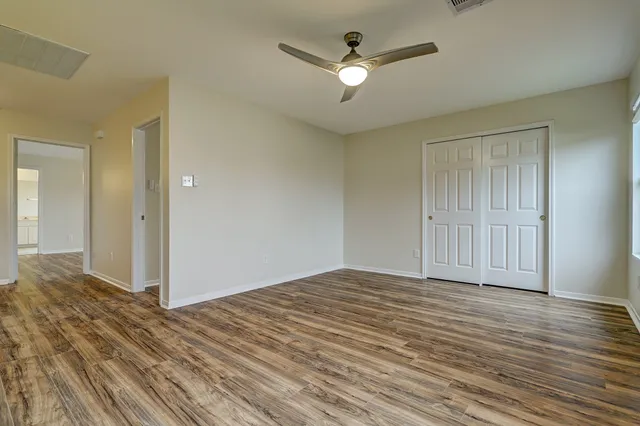 a view of a livingroom with wooden floor