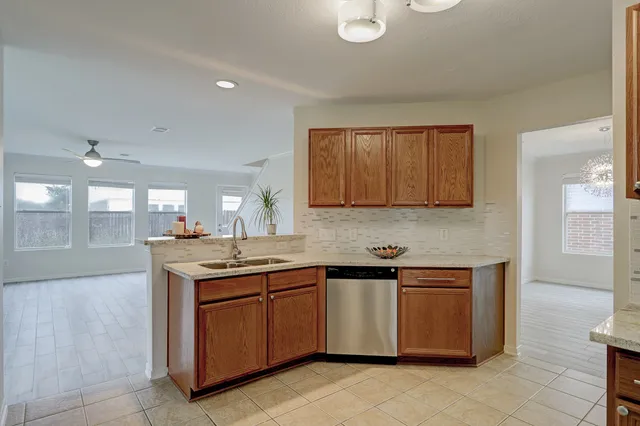 a kitchen with a sink and cabinets