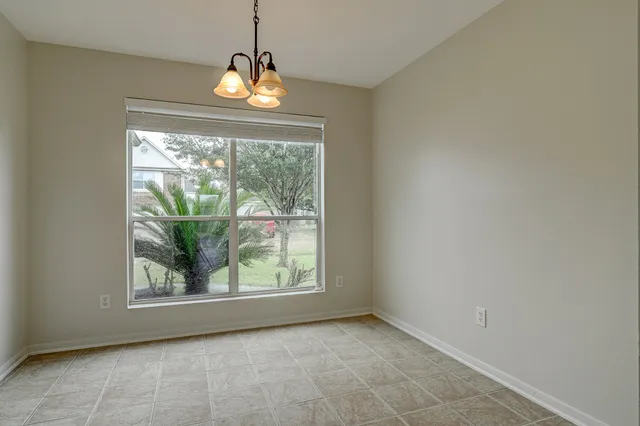 a view of an empty room with windows