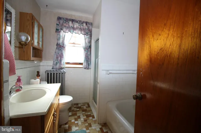 a view of a livingroom with furniture and a window