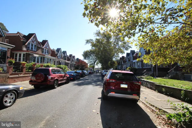 a view of a car parked in front of a house