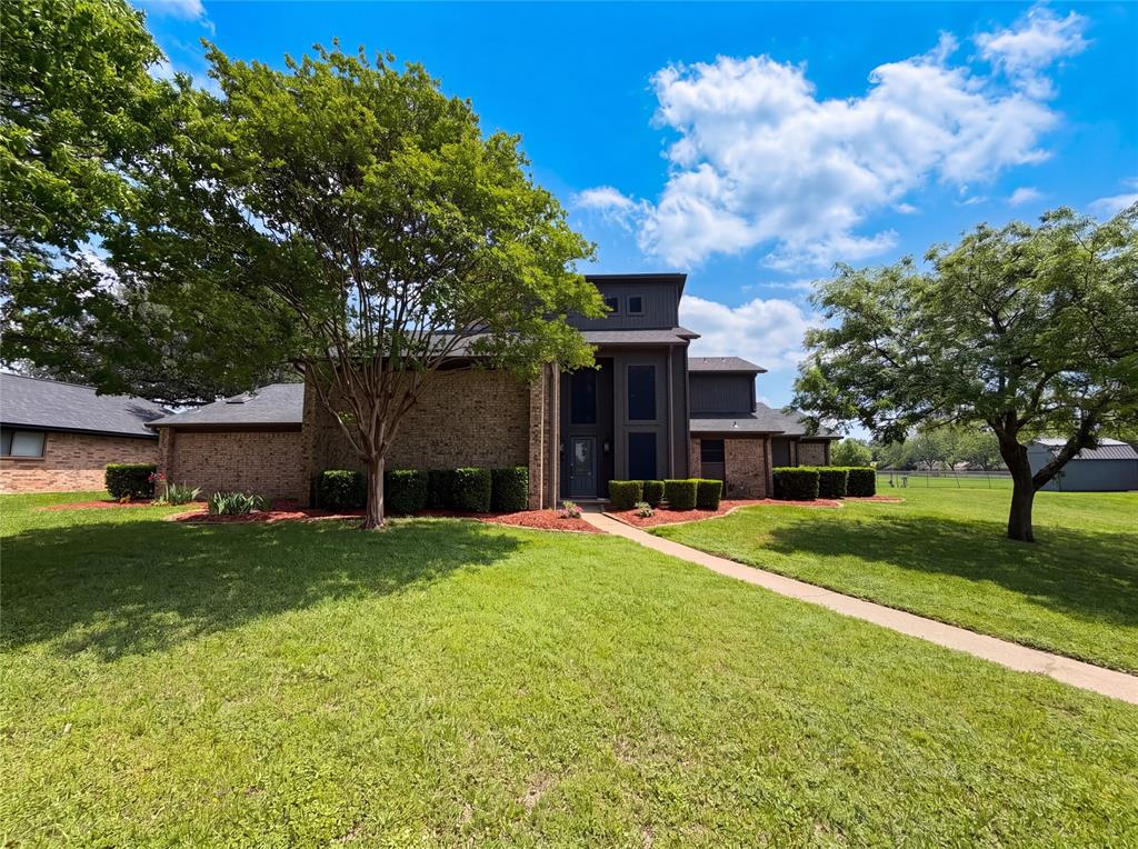 404 Laurel Trail North Terrell, TX 75160 - Photo 1 of 29 a front view of a house with a yard and garage