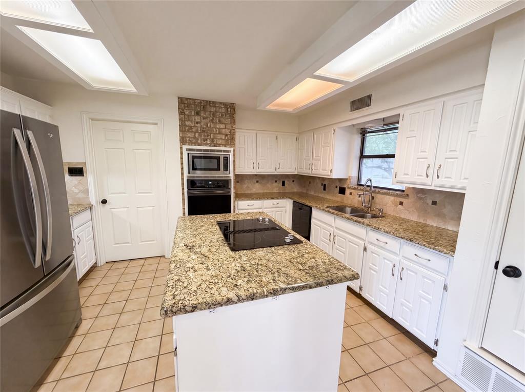 404 Laurel Trail North Terrell, TX 75160 - Photo 11 of 29 a kitchen with stainless steel appliances granite countertop a sink stove and refrigerator