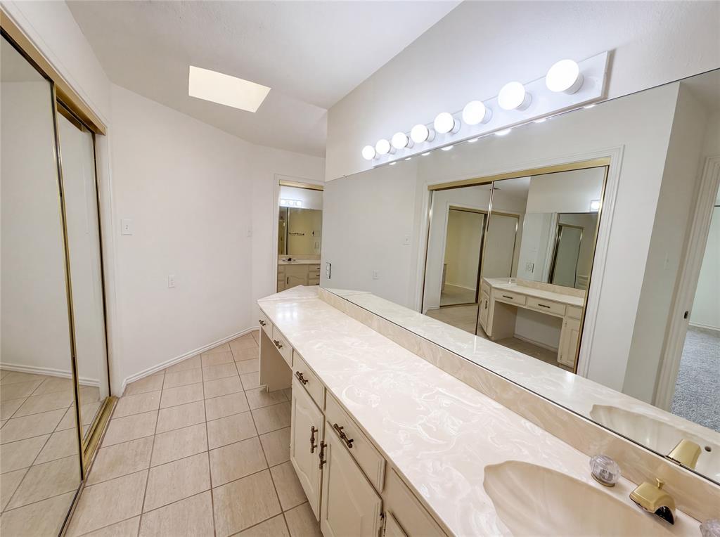 404 Laurel Trail North Terrell, TX 75160 - Photo 15 of 29 a spacious bathroom with a granite countertop sink a mirror and a shower