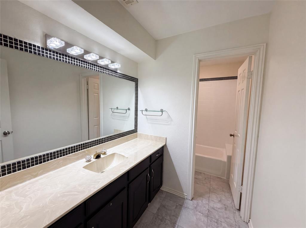 404 Laurel Trail North Terrell, TX 75160 - Photo 23 of 29 a bathroom with a sink a mirror and a shower