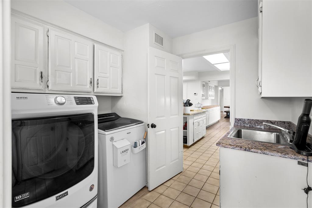 404 Laurel Trail North Terrell, TX 75160 - Photo 25 of 29 a kitchen with granite countertop white cabinets and white appliances