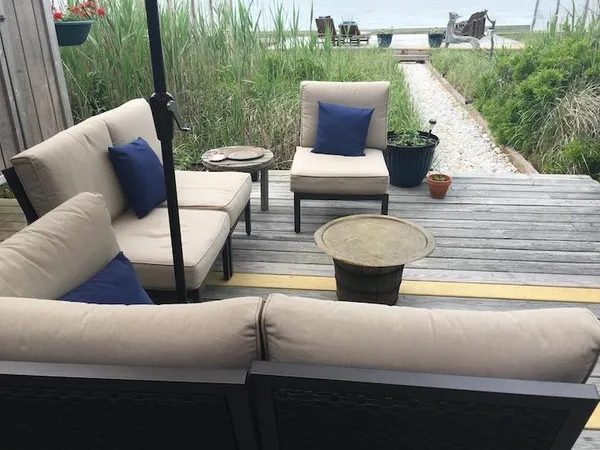 a view of outdoor sitting area with furniture and garden