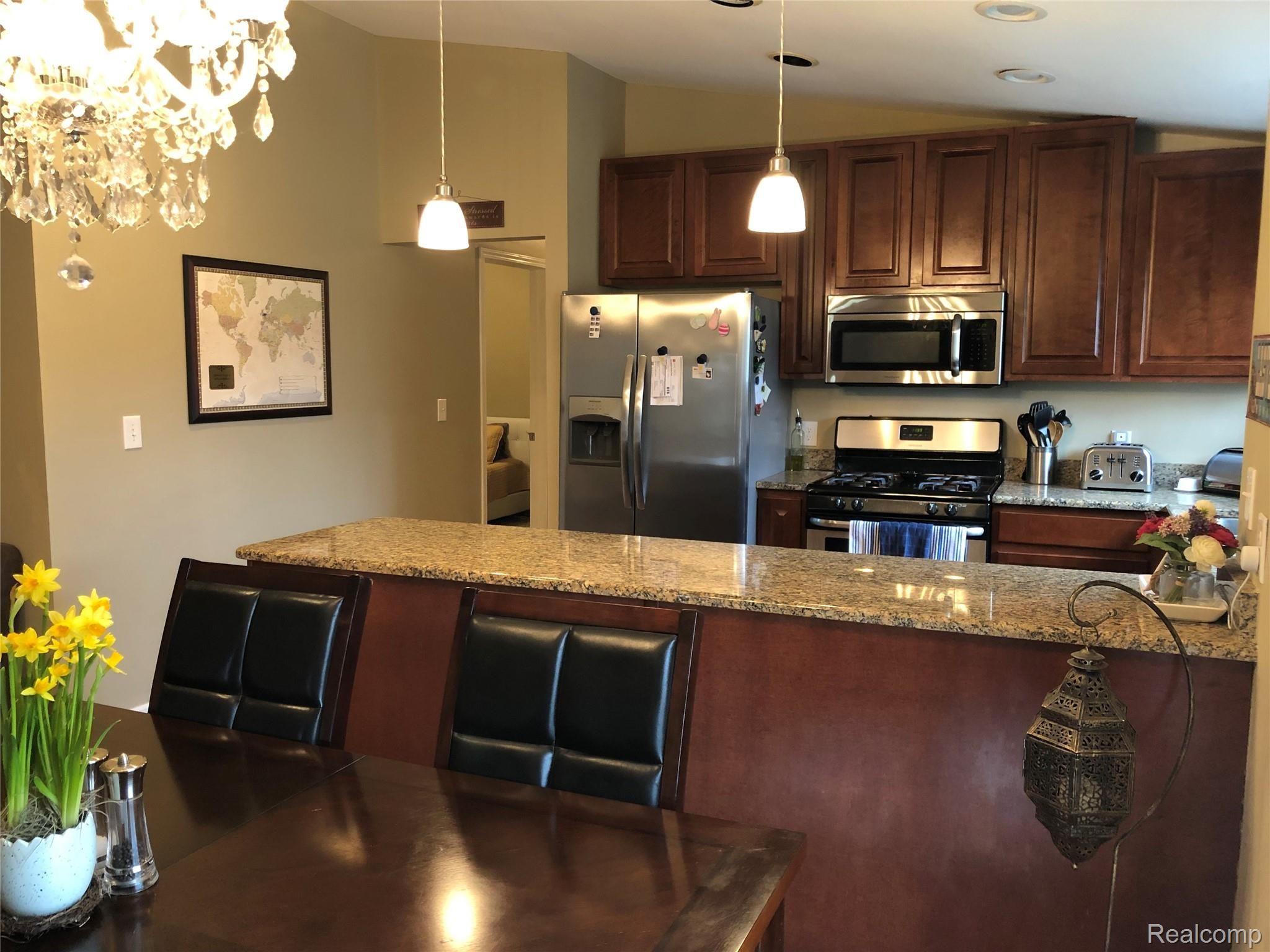 5910 North Beck Road Canton, MI 48187 - Photo 9 of 38 Kitchen with stainless steel appliances & granite countertops!
