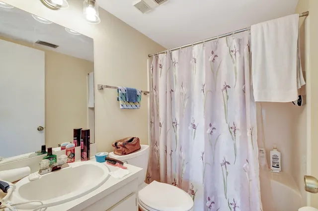 a bedroom with bed and a window