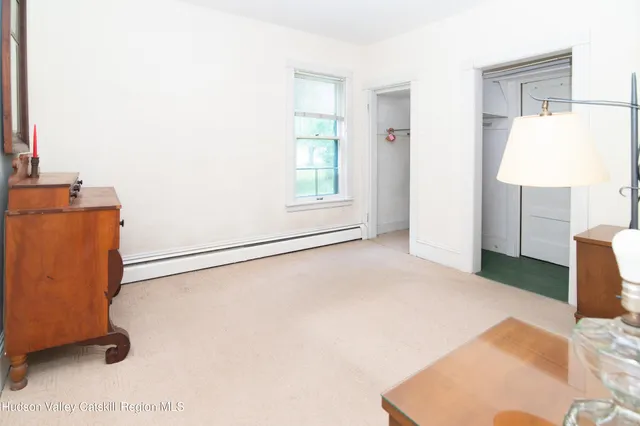 a view of a room with wooden floor and cabinet