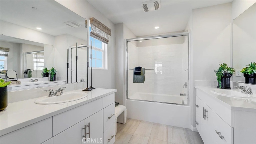 1279 Galaxy Way Rialto, CA 92376 - Photo 14 of 24 a bathroom with a sink a toilet and shower