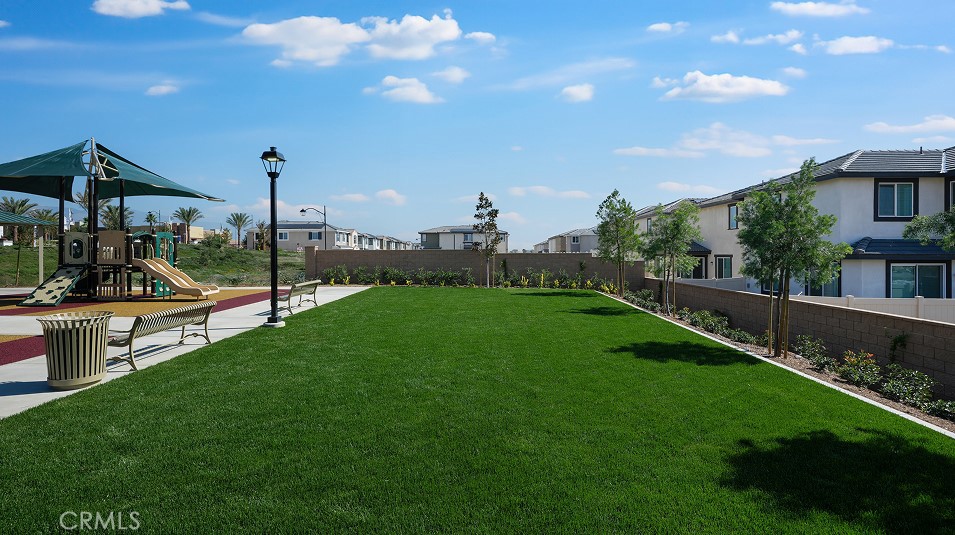 1279 Galaxy Way Rialto, CA 92376 - Photo 21 of 24 a view of a garden with palm trees