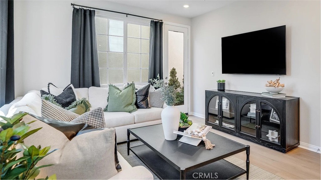 1279 Galaxy Way Rialto, CA 92376 - Photo 5 of 24 a living room with furniture and a flat screen tv