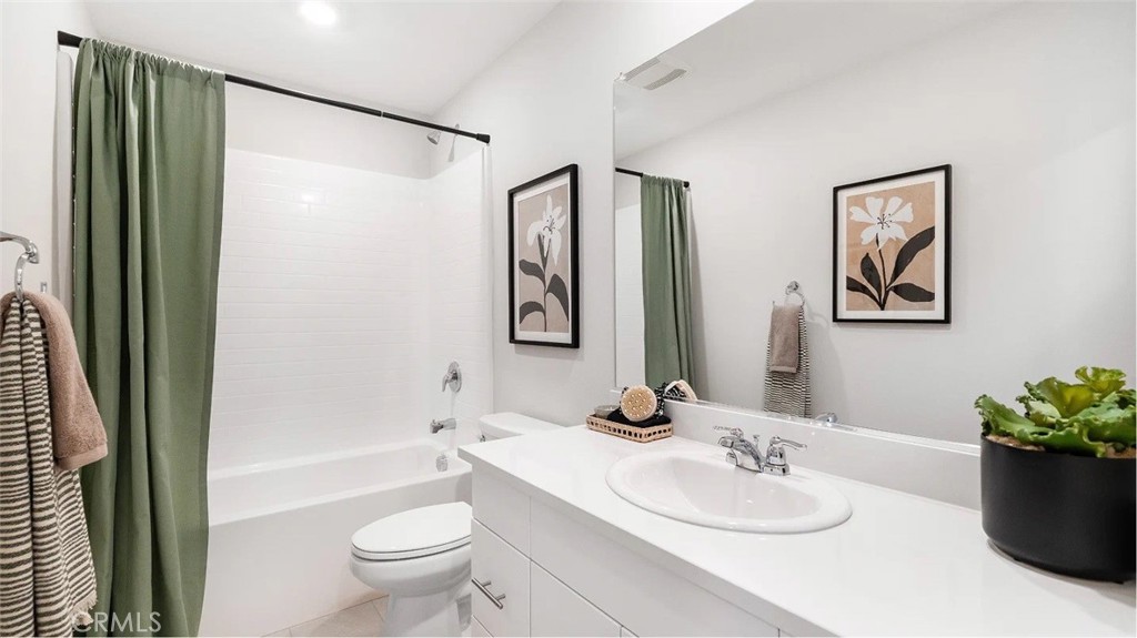 1279 Galaxy Way Rialto, CA 92376 - Photo 7 of 24 a bathroom with a granite countertop sink toilet and shower