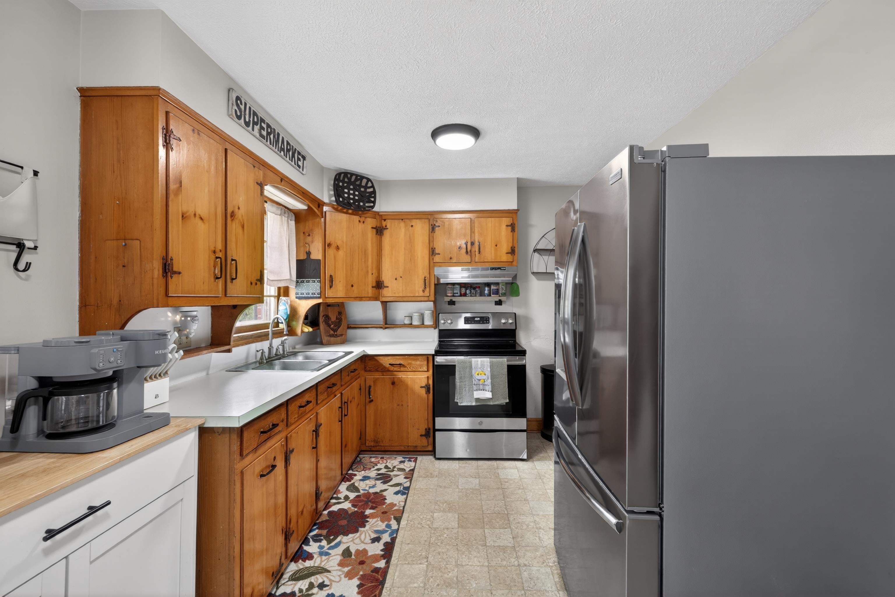7827 Lee Highway Raphine, VA 24472 - Photo 18 of 62 a kitchen with stainless steel appliances granite countertop a refrigerator and a sink