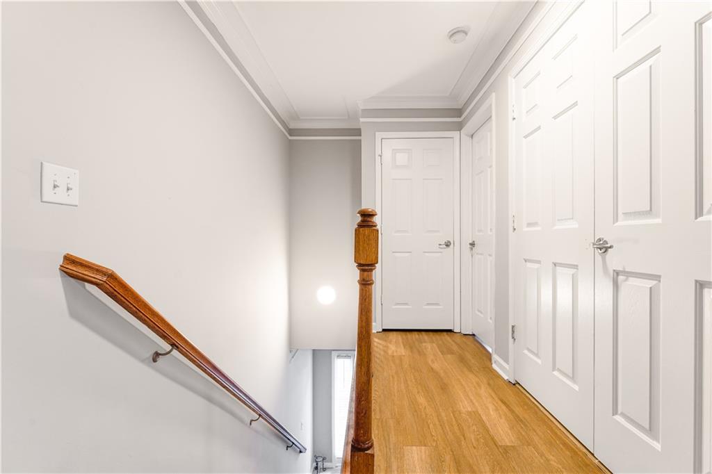 5331 Sherwin Drive Norcross, GA 30093 - Photo 14 of 29 a view of a hallway with wooden floor and staircase