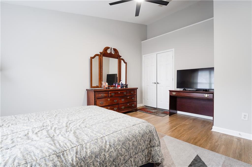 5331 Sherwin Drive Norcross, GA 30093 - Photo 17 of 29 a bedroom with a bed and a flat screen tv