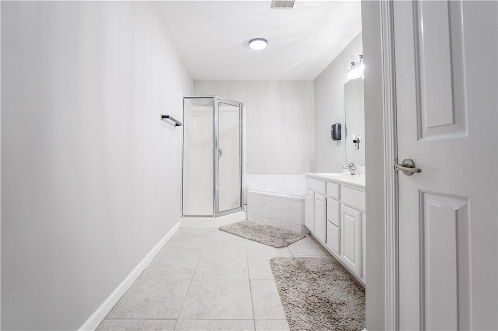 5331 Sherwin Drive Norcross, GA 30093 - Photo 18 of 29 a bathroom with a sink and a shower