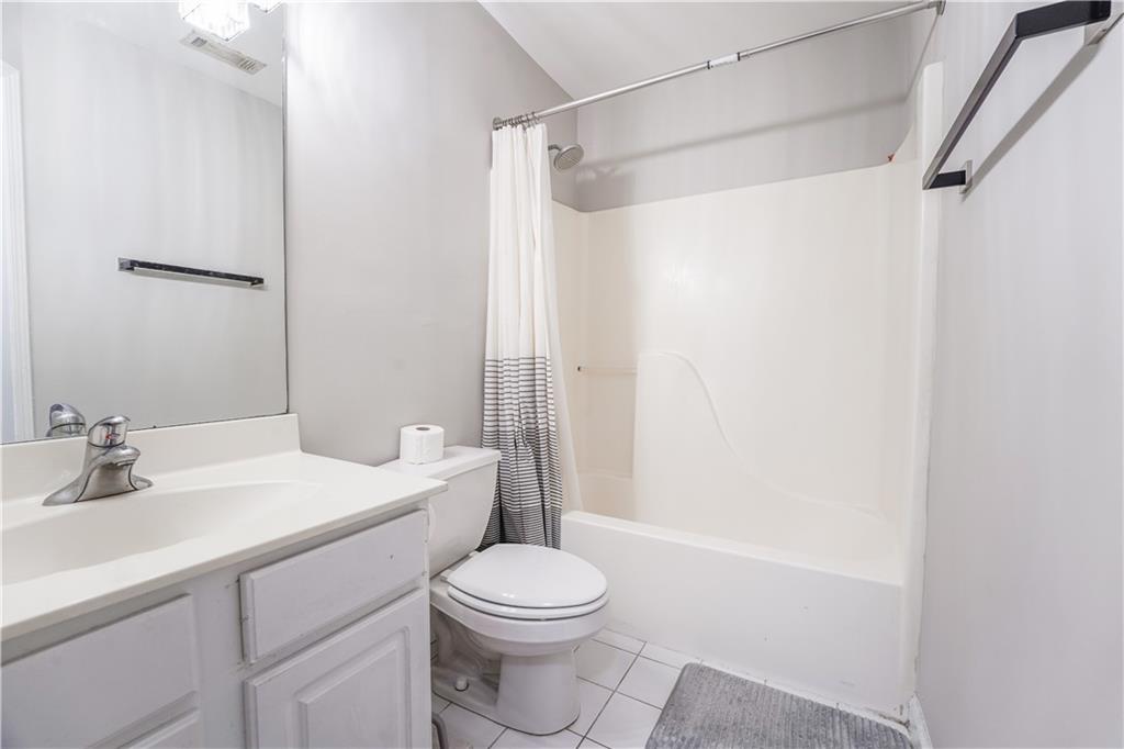 5331 Sherwin Drive Norcross, GA 30093 - Photo 23 of 29 a bathroom with a sink a toilet and shower