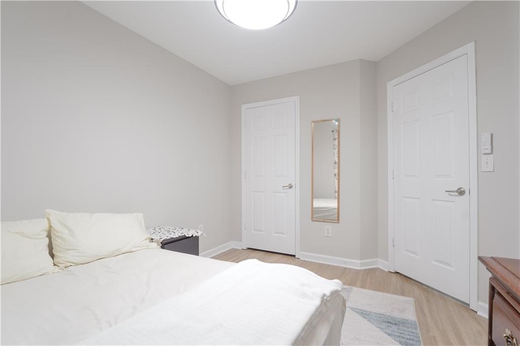 5331 Sherwin Drive Norcross, GA 30093 - Photo 28 of 29 a bedroom with a bed and a granite countertop