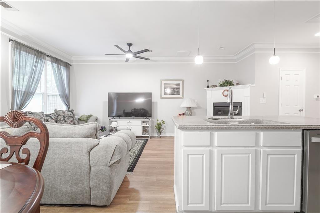 5331 Sherwin Drive Norcross, GA 30093 - Photo 6 of 29 a living room with furniture a flat screen tv and a large window