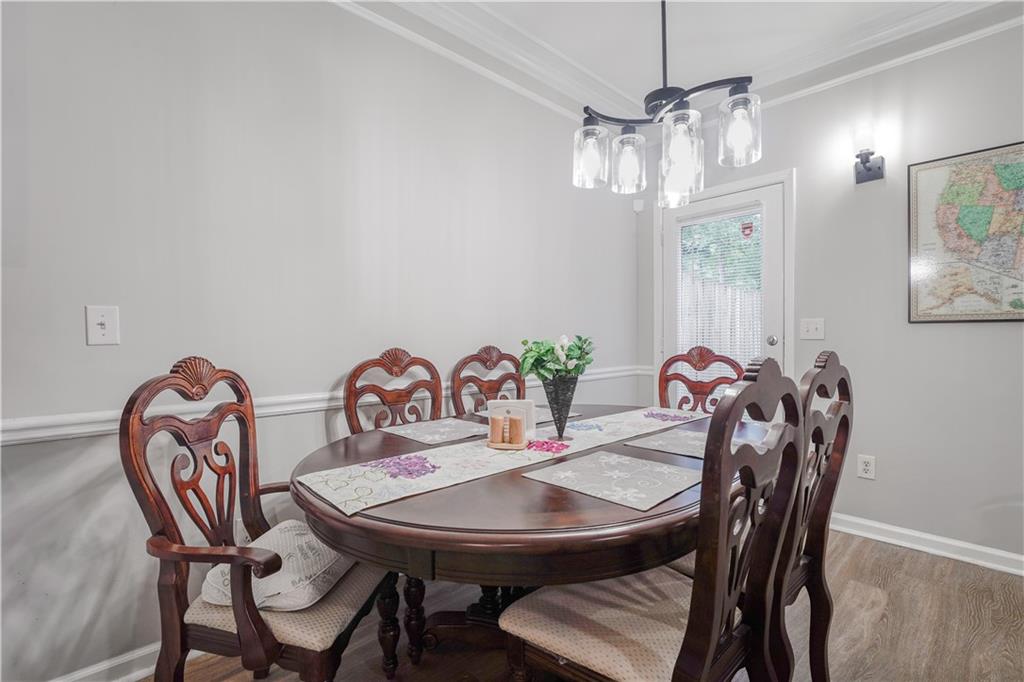 5331 Sherwin Drive Norcross, GA 30093 - Photo 7 of 29 a view of a dining room with furniture and wooden floor