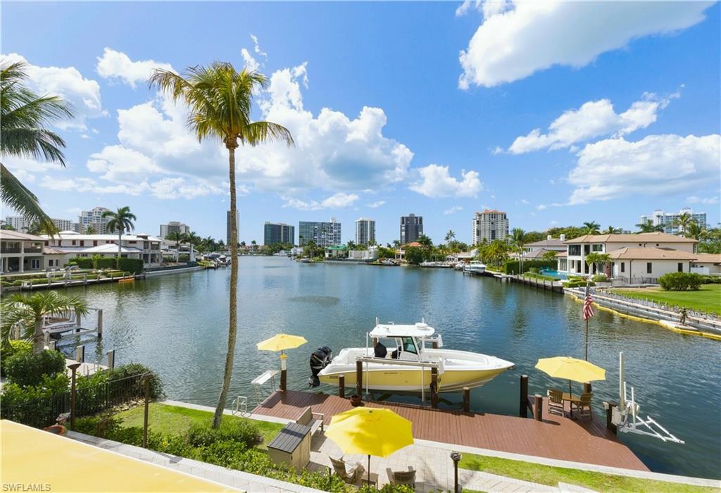 361 Pirates Bight Naples, FL 34103 - Photo 43 of 45 a view of a lake with houses