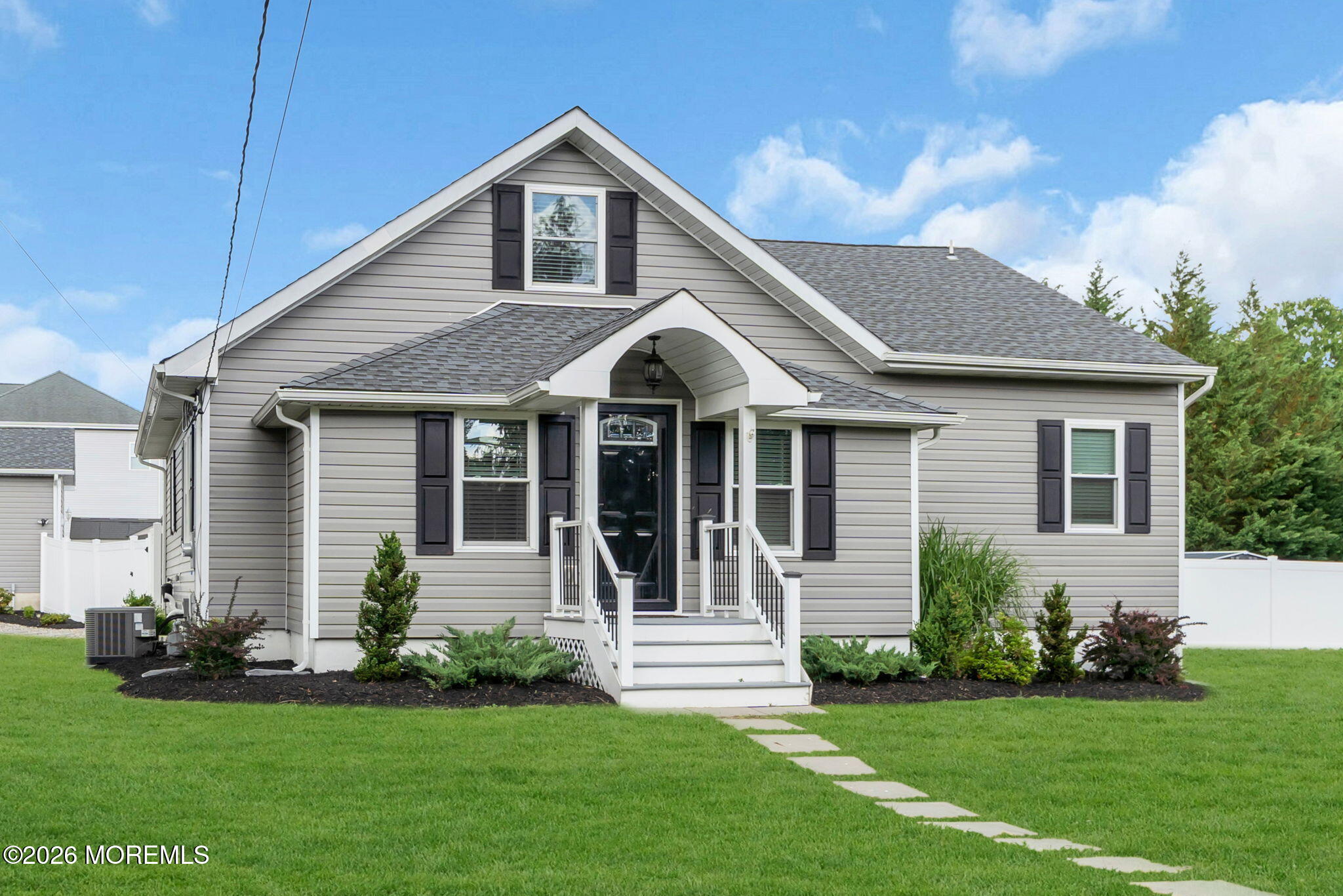 181 Locust Avenue Howell, NJ 07731 - Photo 4 of 66 a front view of a house with a garden and yard