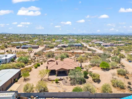 an aerial view of residential houses with outdoor space