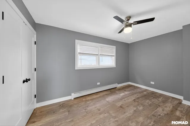 a view of room with window and ceiling fan