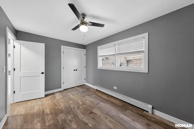 a view of room with window and ceiling fan