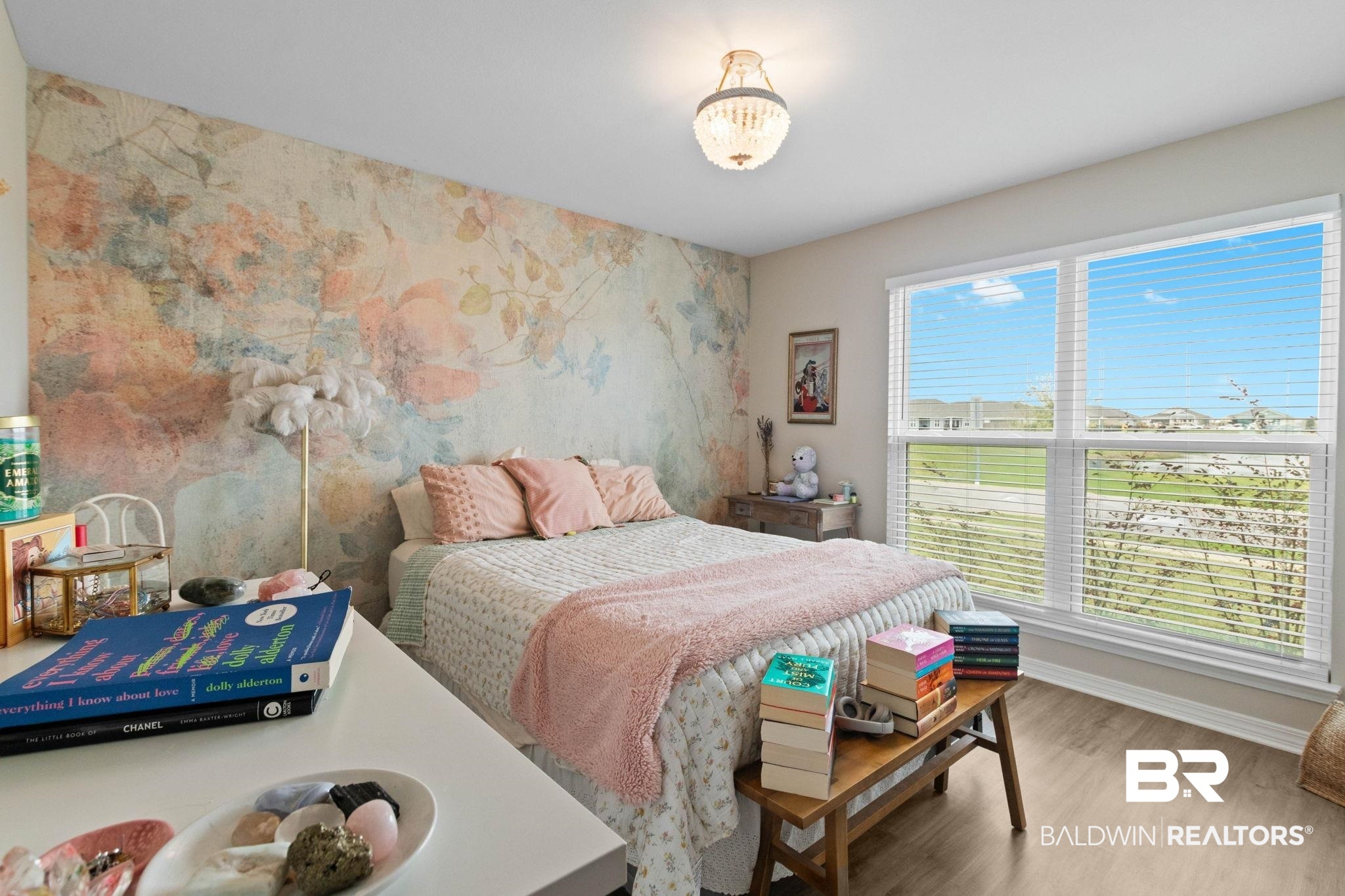 1203 Hayward Loop Foley, AL 36535 - Photo 21 of 41 Bedroom with an accent wall and wood finished floors