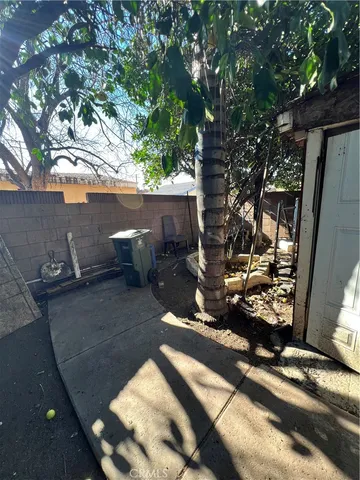 a view of a backyard of the house