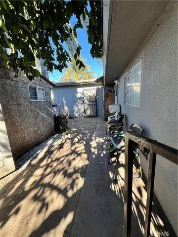 a view of a backyard house with a patio