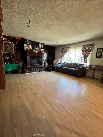 a view of a livingroom with furniture and a fireplace