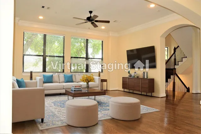 a living room with furniture and a large window