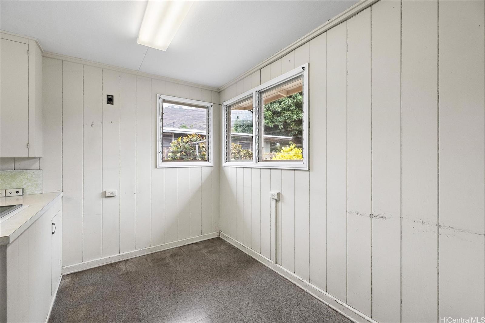 5558 Pia Street Honolulu, HI 96821 - Photo 13 of 25 a view of an empty room with a window